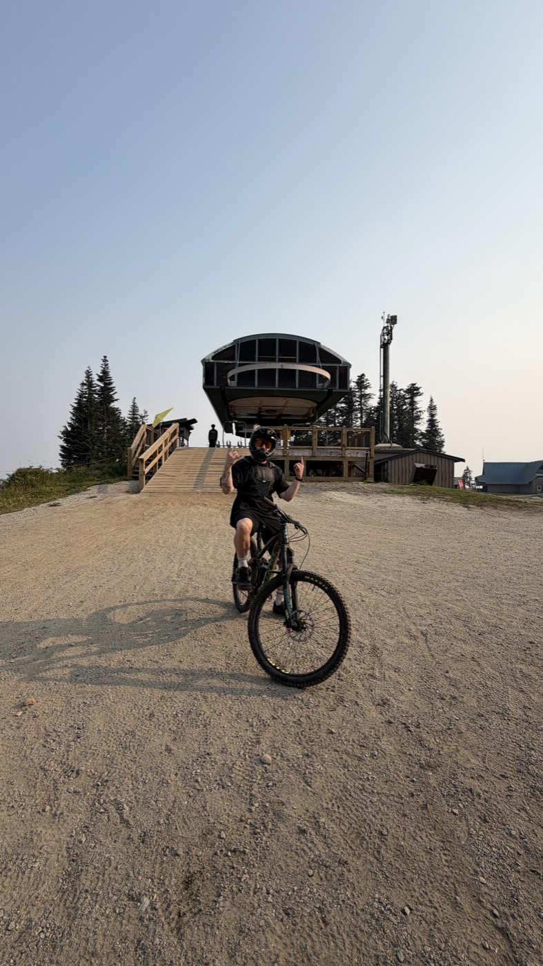 Ben on his mountain bike at the top of a lift